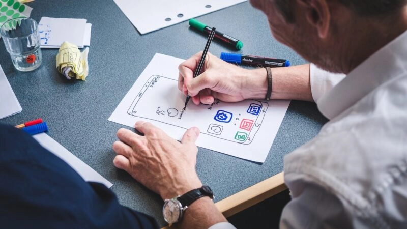 Designer draws the layout for a digital interface